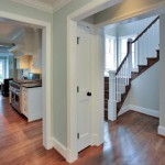 Doorways of renovated home in Arlington showing staircase and kitchen, Virginia